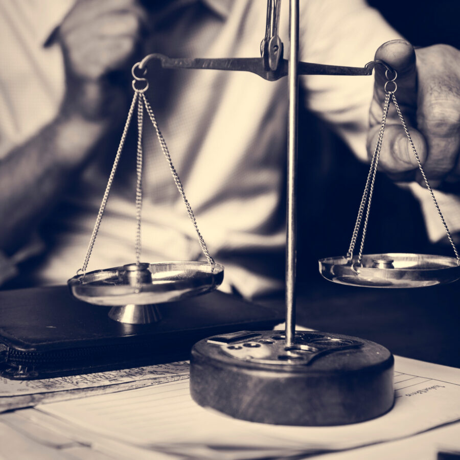 Attorney with scale on the table